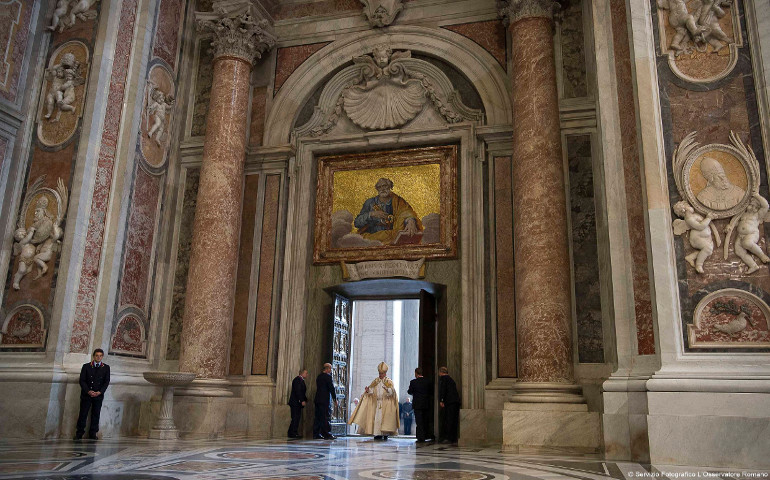 Pope Francis walks through the Holy Door of St. Peter's Basilica to inaugurate the Jubilee Year of Mercy at the Vatican Dec. 8. (CNS/L'Osservatore Romano, handout)