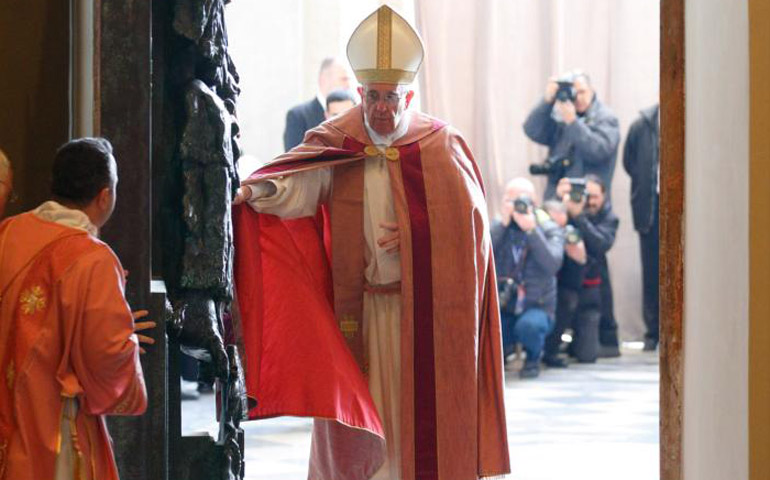 Pope Francis opens the Holy Door of the Basilica of St. John Lateran in Rome Dec. 13. (CNS/Paul Haring)