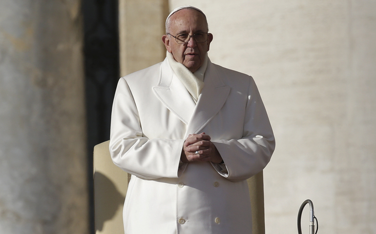 Pope Francis prays at his weekly audience in St. Peter's Square at the Vatican Dec. 30. (CNS/Max Rossi, Reuters)