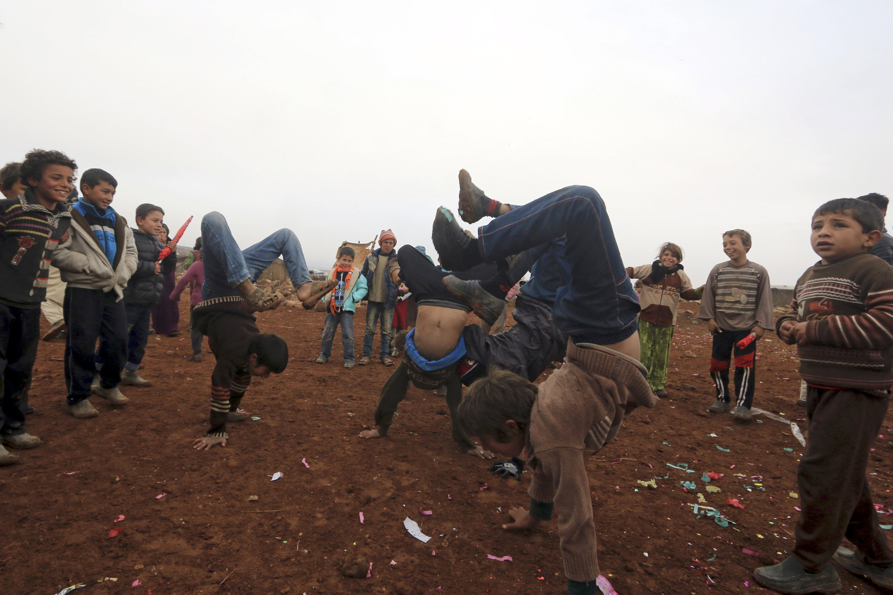 Children play inside a camp for displaced Syrians in Hama, Syria, Jan. 1. (CNS/Reuters/Ammar Abdullah)