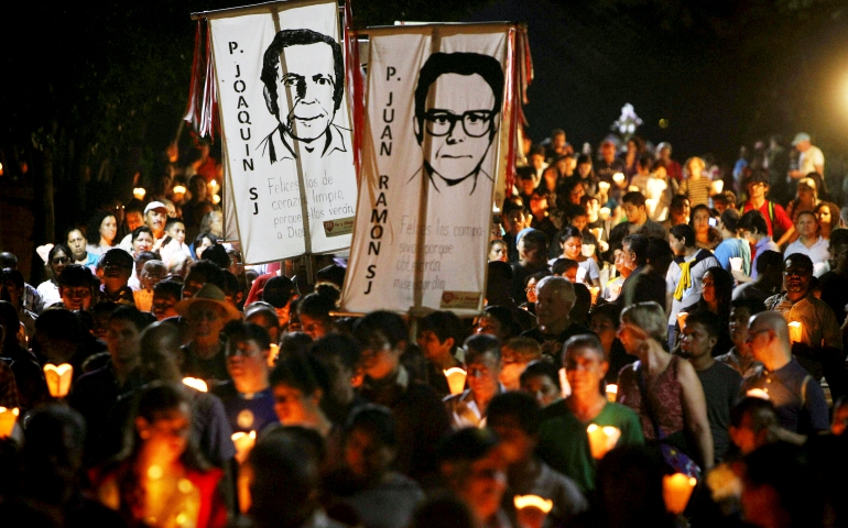 People participate in the "little lanterns march" at Central American University in San Salvador during the 2015 commemoration of the 26th anniversary of the massacre of six Jesuit priests and two women, murdered in November 1989. (CNS/EPA/Oscar Rivera)