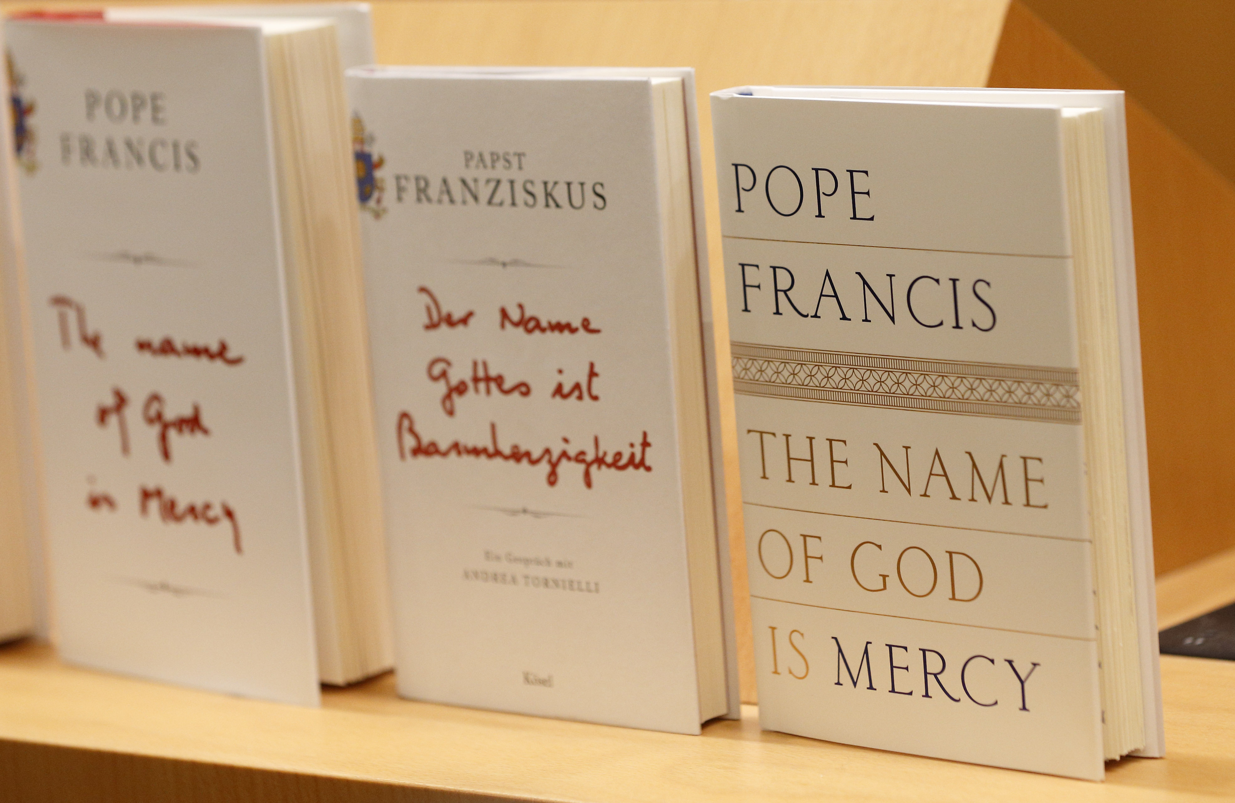 The English and German editions of "The Name of God Is Mercy" are pictured in Rome Jan. 12. (CNS/Paul Haring)