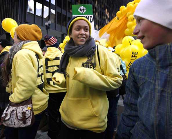 Amber Brown, 14, dances before getting ready to start the march as thousands of participants brave sub-zero wind-chill temperatures during Chicago's March for Life at Federal Plaza Jan. 17. (CNS/Karen Callaway, Catholic New World)