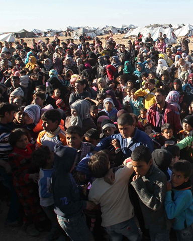 Syrian refugees wait at the border near Royashed, Jordan, Jan. 14. (CNS/Stringer, EPA)