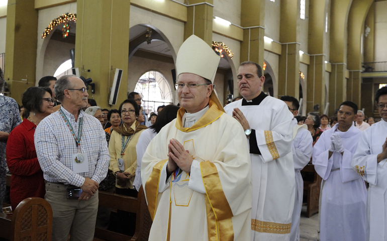 Bishop Michael Barber arrives in procession during a Mass for U.S. pilgrims at the 51st International Eucharistic Congress in Cebu, Philippines, Jan. 27, 2016. (CNS/Katarzyna Artymiak)