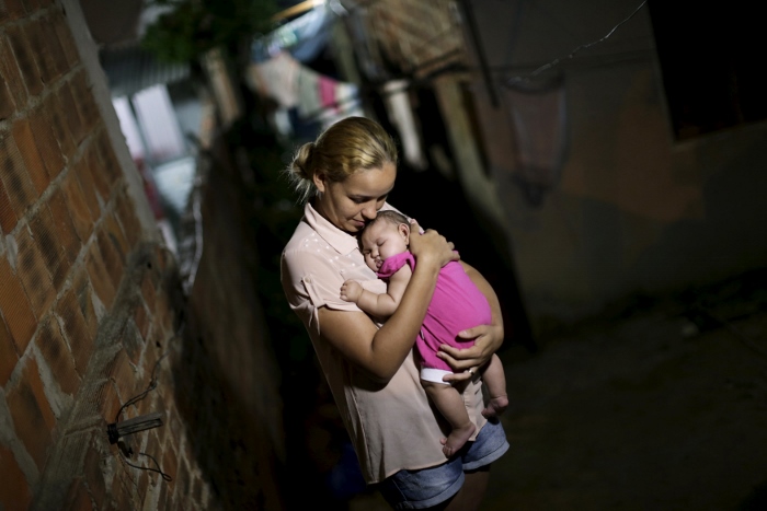 Gleyse Kelly da Silva poses for a photo Jan. 25 with her daughter, Maria Giovanna, who has microcephaly, in Recife, Brazil. (CNS photo/Ueslei Marcelino, Reuters)