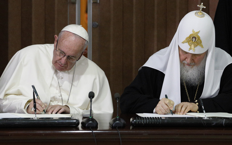 Pope Francis and Russian Orthodox Patriarch Kirill of Moscow sign a joint declaration during a meeting at Jose Marti International Airport in Havana Feb. 12. (CNS/Paul Haring) 