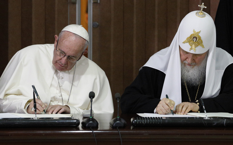 Pope Francis and Russian Orthodox Patriarch Kirill of Moscow sign a joint declaration during a meeting at Jose Marti International Airport in Havana Feb. 12. (CNS/Paul Haring)