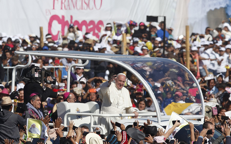 Pope Francis greets the crowd as he arrives to celebrate Mass with the indigenous community from Chiapas Feb. 15 in Mexico. (CNS/Paul Haring)