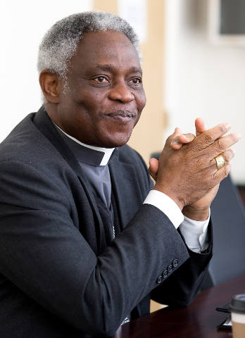 Ghanaian Cardinal Peter Turkson, president of the Pontifical Council for Justice and Peace, speaks Feb. 19 during a two-day international conference on climate change on the campus of St. Thomas University in Miami. (CNS photo/Tom Tracy)