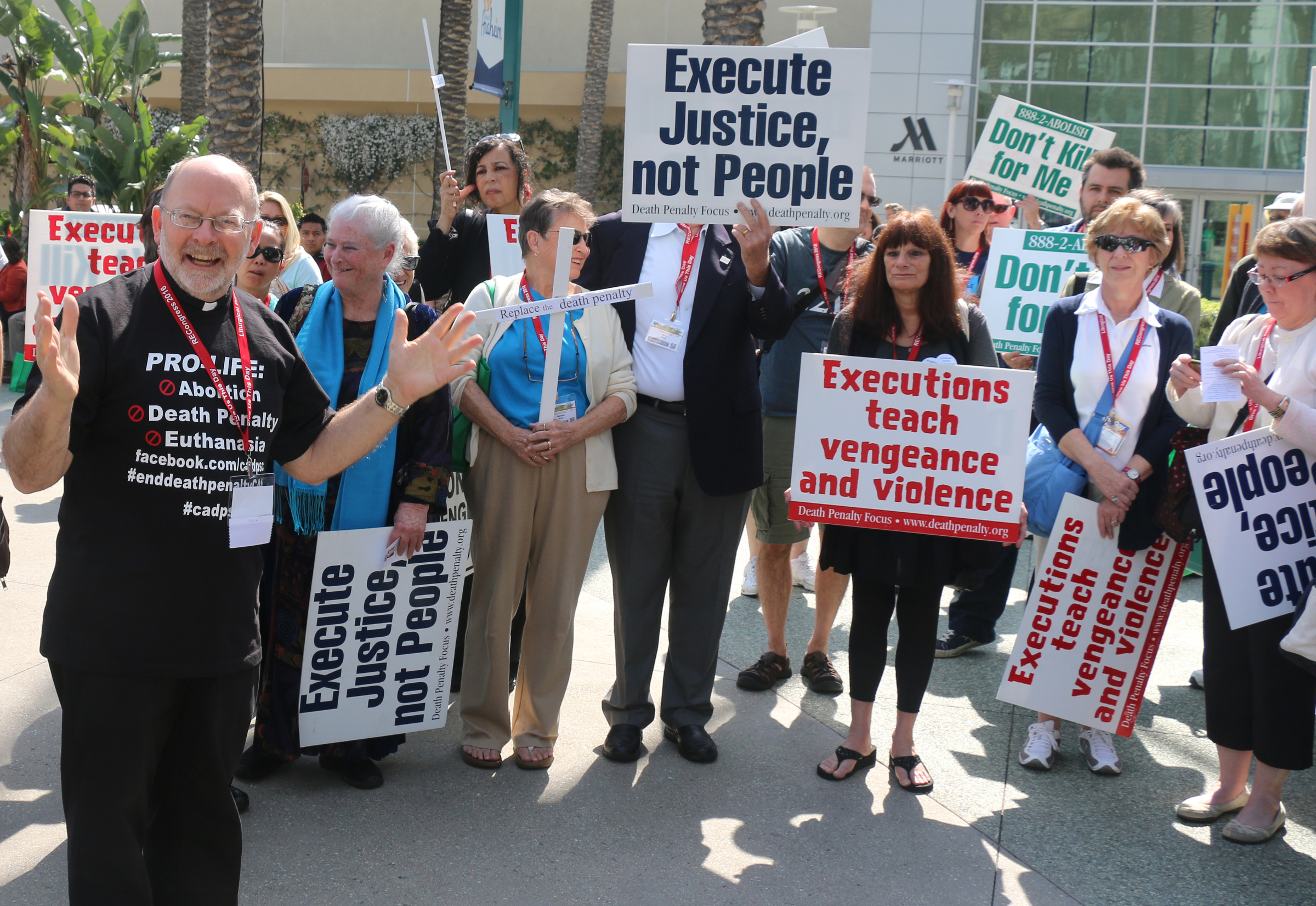 An unidentified priest leads a demonstration against the death penalty Feb. 27 as part of the Los Angeles Religious Education Congress in Anaheim, Calif. (CNS/The Tidings/J.D. Long-Garcia)