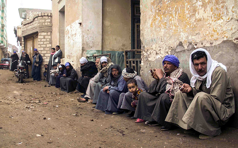 People gather in Minya, Egypt, Feb. 16, for the funeral of Coptic Christians kidnapped and killed by Islamic State rebels in Libya. (CNS/Alaa Elkamhawia, EPA)