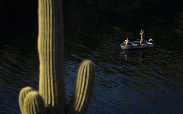 Men fish in Saguaro Lake in the Tonto National Forest outside of Mesa, Ariz., March 21, 2016. (CNS/Nancy Wiechec)