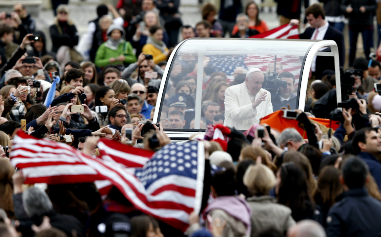 U.S. flags are seen as Pope Francis greets the crowd in St. Peter's Square at the Vatican in March 2016. (CNS/Paul Haring)