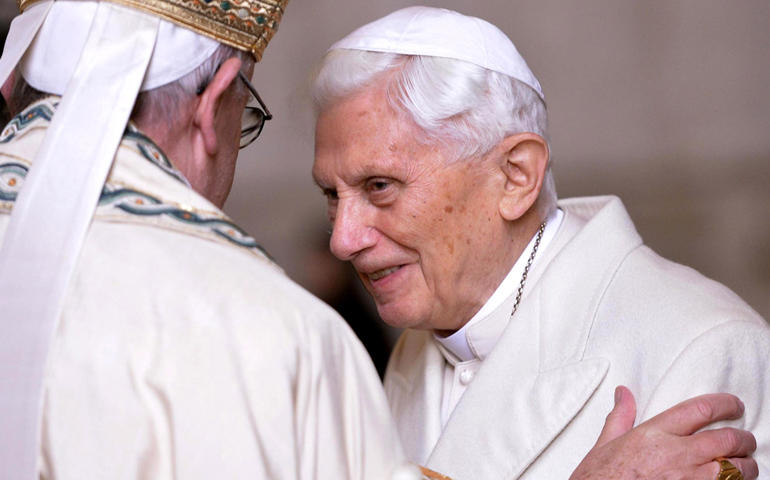 Pope Francis greets retired Pope Benedict XVI at the Vatican in 2015. (CNS/Maurizio Brambatti, EPA)