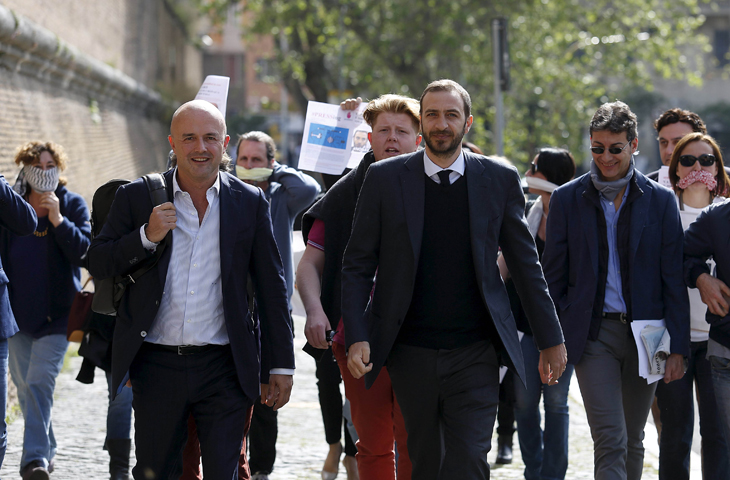 Journalists Gianluigi Nuzzi and Emiliano Fittipaldi, center, walk to their trial April 6 at the Vatican. (CNS/Remo Casilli, Reuters)
