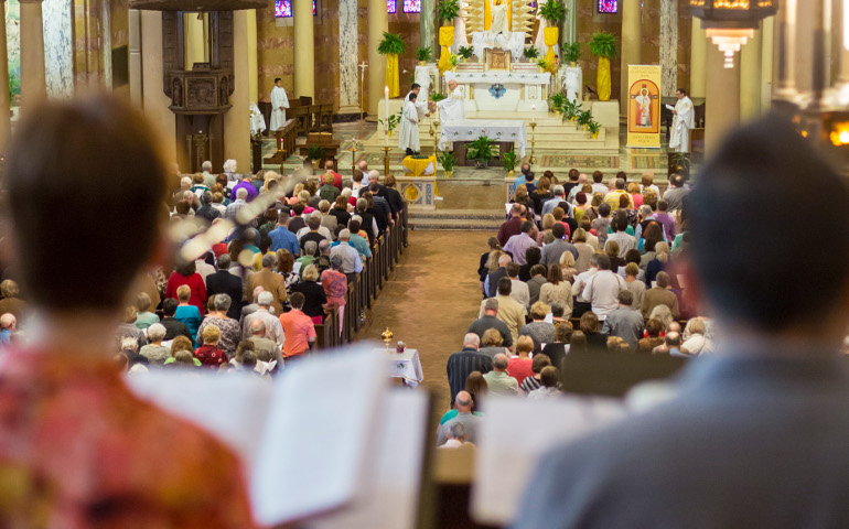 People pray during Mass April 17, 2016, at Holy Redeemer Church in Detroit. The Mass was the site of a “Mass Mob” event, an evangelization effort aimed at boosting regular Mass attendance. (CNS/Jim West)