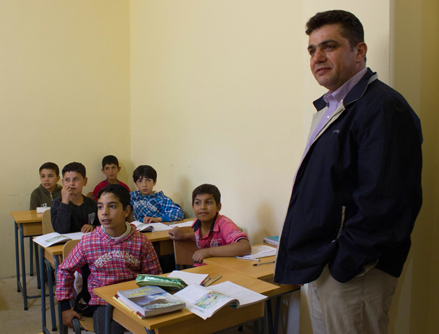 Fr. Nawras Sammour, Jesuit Refugee Service's Syria director, visits the JRS school for Syrian children in Lebanon's Bekaa Valley in 2013. (CNS/Zerene Haddad, JRS) 