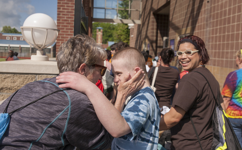 Brandon Anderson, 12, hugs his mother, Judy Anderson on his way to compete in the Special Olympics April 22, 2016, in Nashville, Tenn. Father Ryan High School hosted 376 athletes for the annual event. (CNS/Rick Musacchio, Tennessee Register)