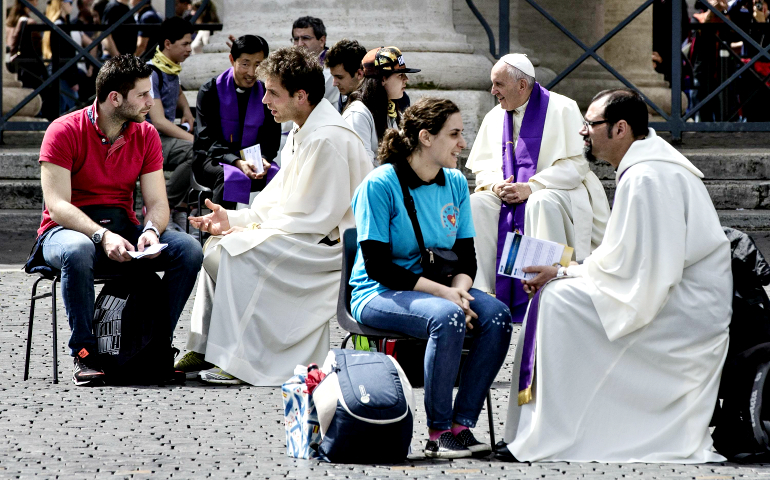 Pope Francis and other clergymen hear confessions from young people April 23 in St. Peter's Square at the Vatican during a Year of Mercy event for teens. (CNS/EPA/Angelo Carconi)
