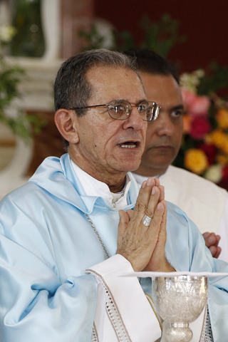 Cuban Archbishop Juan Garcia Rodriguez of Camaguey celebrates Mass in 2012 at the Shrine of Our Lady of Charity of El Cobre in Cuba. (CNS/Nancy Wiechec) 