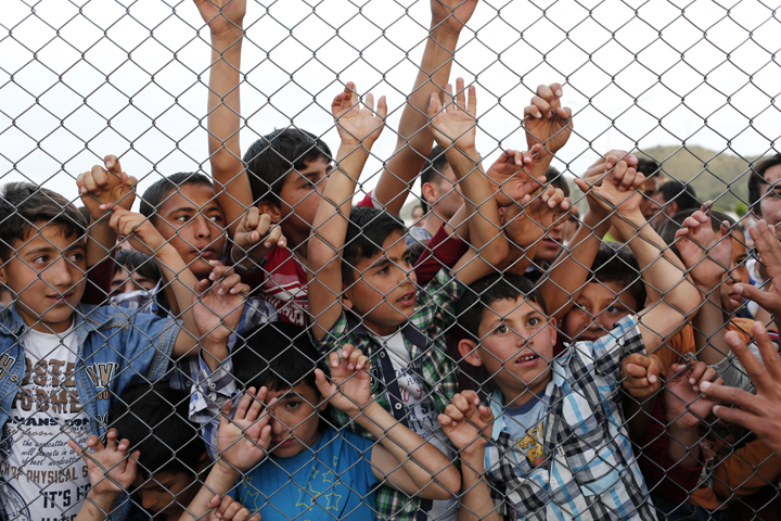 Syrian children stand at a fence April 23 at a refugee camp near Gaziantep, Turkey. (CNS/Sedat Suna, EPA)