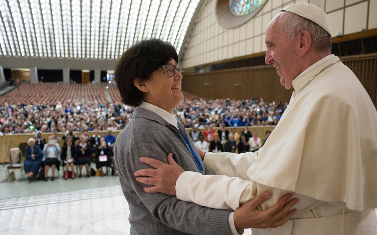 Pope Francis greets Sister Carmen Sammut, president of the International Union of Superiors General, during an audience with the heads of women's religious orders in Paul VI hall at the Vatican May 12. During a question-and-answer session with members of the UISG, the pope said he was willing to establish a commission to study whether women could serve as deacons. (CNS/L'Osservatore Romano) 