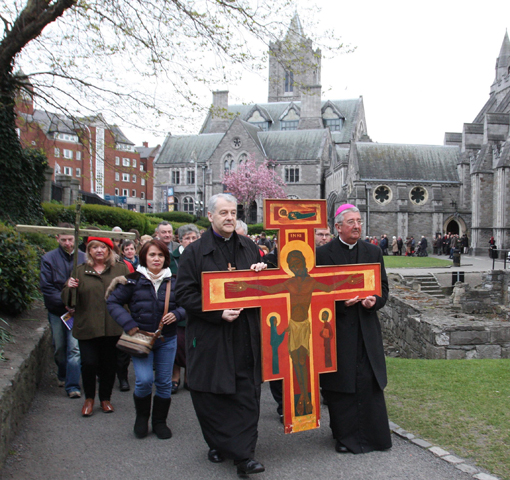 Anglican Archbishop Michael Jackson and Archbishop Diarmuid Martin of Dublin lead an ecumenical Good Friday procession in 2012 in Dublin. (CNS/John Mc Elroy) 