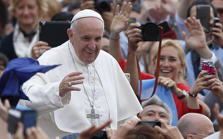 Pope Francis greets the crowd during his general audience in St. Peter's Square at the Vatican June 1. (CNS/Paul Haring)