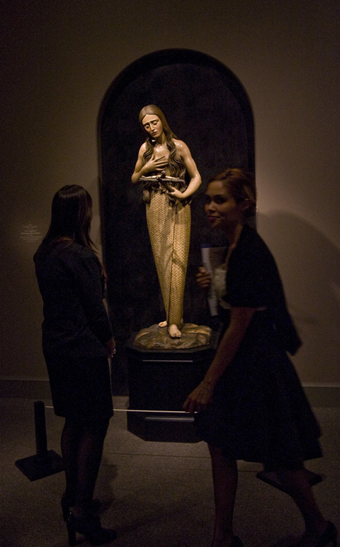 St. Mary Magdalene is shown meditating on the crucifix in this painted wooden sculpture that is part of The Sacred Made Real exhibit in 2010 at the National Galley of Art in Washington. (CNS/Nancy Wiechec) 