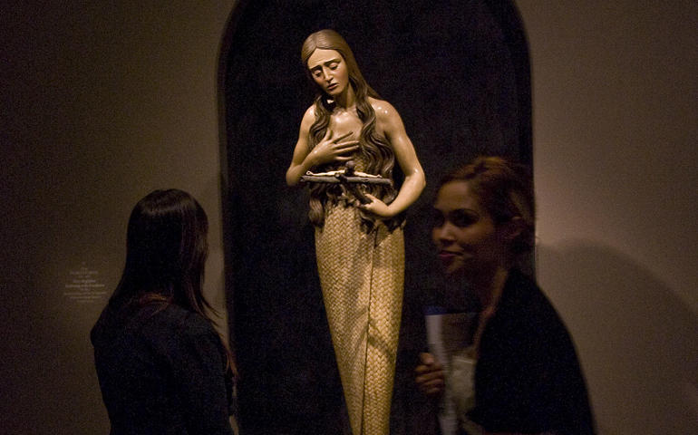 St. Mary Magdalene meditates on the crucifix in this painted wooden sculpture that is part of The Sacred Made Real exhibit in 2010 at the National Galley of Art in Washington. (CNS photo/Nancy Wiechec)