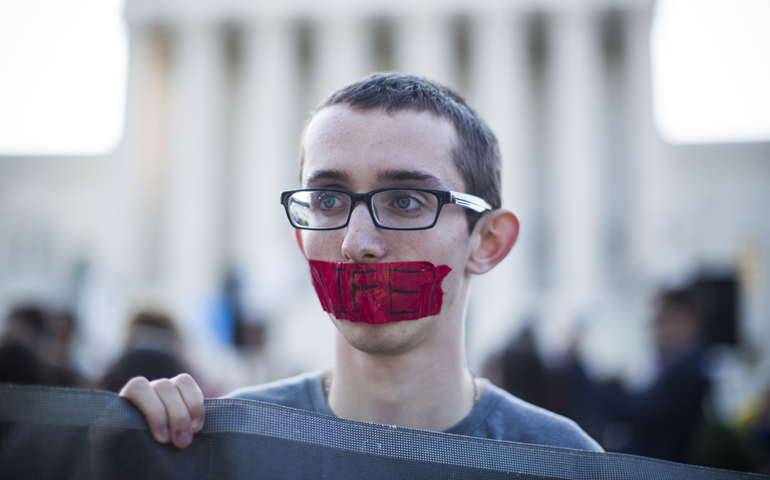 A young pro-life supporter stands outside the U.S. Supreme Court June 26 during protests in Washington.(CNS/Jim Lo Scalzo, EPA)