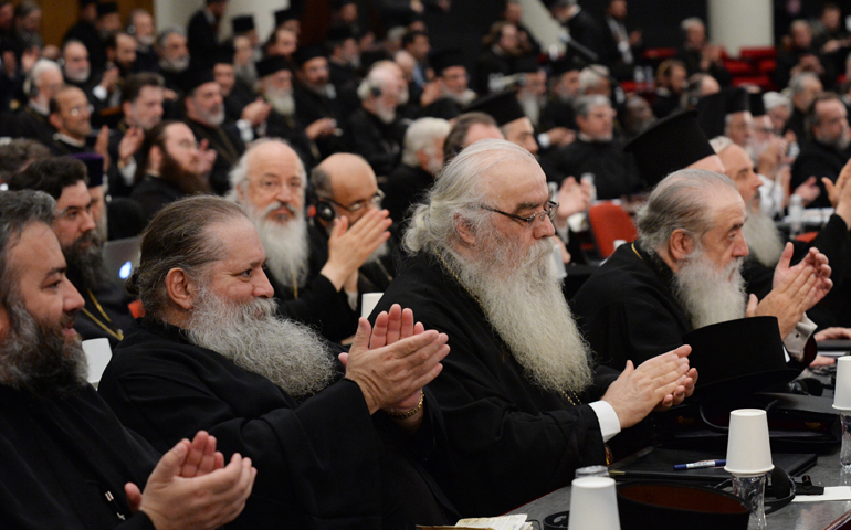 Orthodox leaders applaud June 24 during the Great and Holy Council of the Orthodox Church on the Greek island of Crete. (CNS/Dimitrios Panagos, Greek American News Photo Agency)