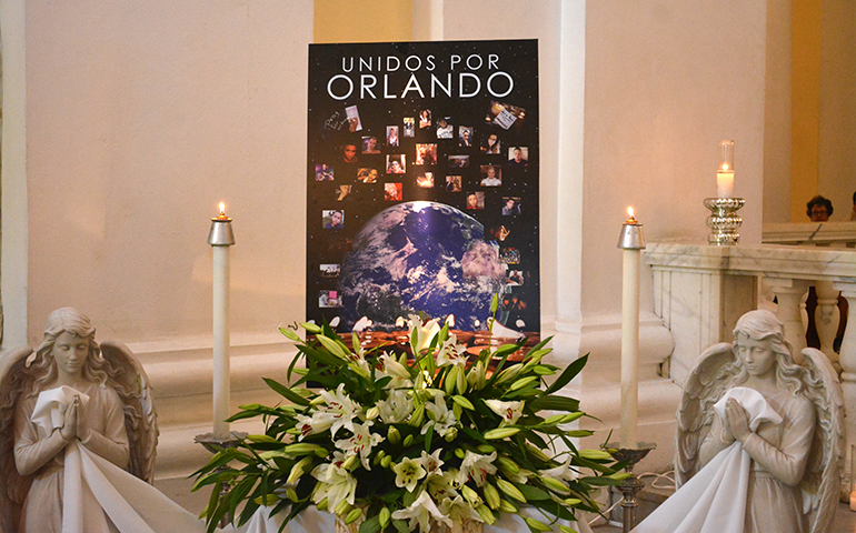 A memorial is displayed June 24 at the San Juan de Bautista Cathedral in Puerto Rico. Archbishop Roberto Gonzalez Nieves of San Juan celebrated a Mass for the victims of the mass shooting in Orlando, Fla. (CNS/Wallice J. de la Vega)