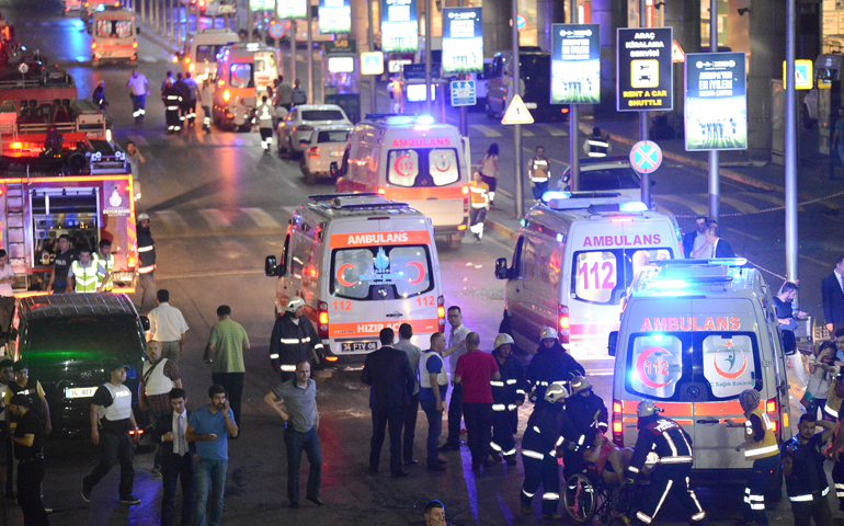 Paramedics help people outside Istanbul's Ataturk Airport following a June 28 suicide attack. (CNS/Ismail Coskun, IHLAS News Agency via Reuters)