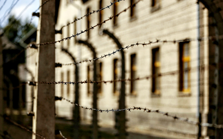 Lines of barbed-wire fencing enclose the Auschwitz-Birkenau Nazi death camp in Oswiecim, Poland. (CNS/Nancy Wiechec)