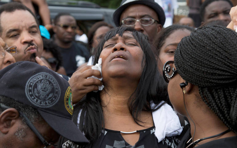 Sandra Sterling reacts during a July 7 vigil in memory of her nephew, Alton Sterling, who was shot dead by police outside a market in Baton Rouge, La. Sterling, 37, was killed early July 5 in a shooting that was captured on cellphone video. (CNS photo/Jeffrey Dubinsky, Reuters)