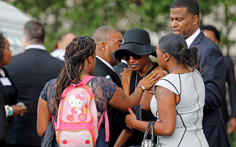 Family members comfort Diamond Reynolds, the girlfriend of Philando Castile, as his casket arrives July 14 for a funeral service at the Cathedral of St. Paul in St. Paul, Minn. (CNS/Eric Miller, Reuters)