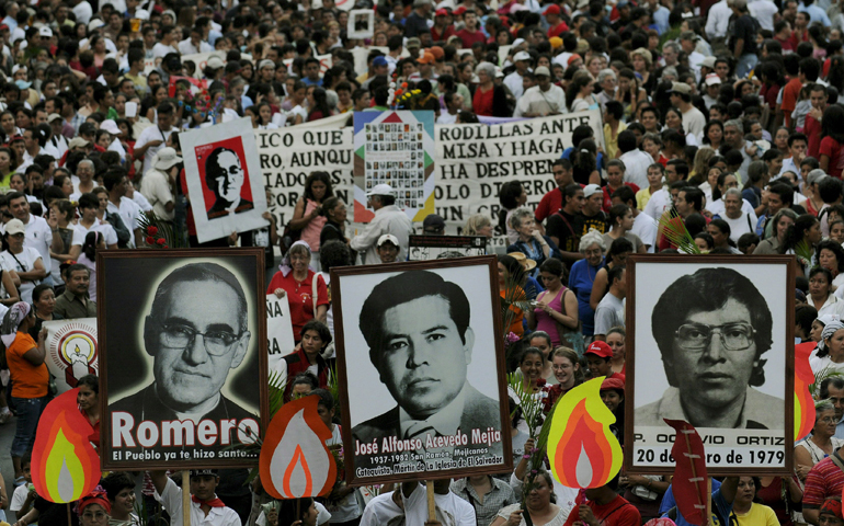 Salvadorans carry a photo of Archbishop Oscar Romero and other victims during a 2008 rally in San Salvador to commemorate the 28th anniversary of their deaths. (CNS/Roberto Escobar, EPA)