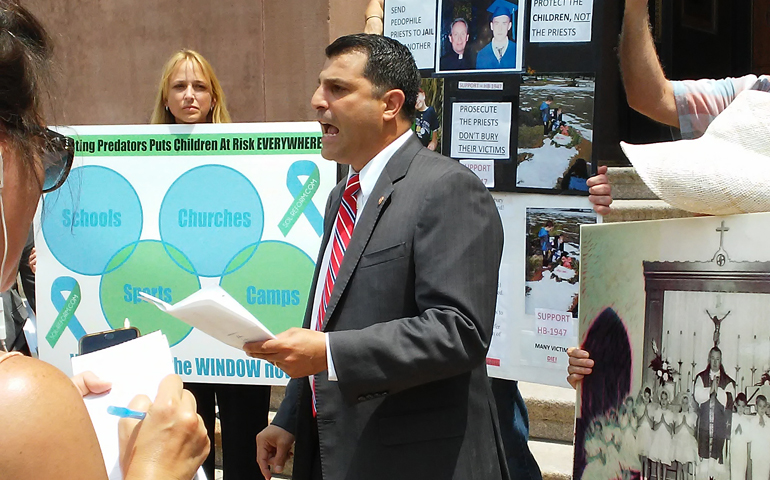 State Rep. Mark Rozzi of Pennsylvania, speaking July 18, surrounded by sex-abuse survivors and victims-rights advocates, outside the Cathedral Basilica of Sts. Peter and Paul in Philadelphia (NCR/Elizabeth Eisenstadt Evans)