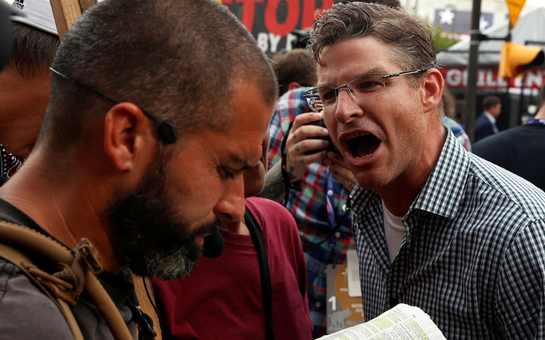 A protester against Donald Trump's candidacy screams at a man reciting passages from Scripture July 18 outside of the Republican National Convention in Cleveland. (CNS/Lucas Jackson, Reuters)