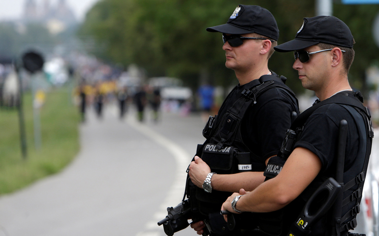 Police officers stand guard during World Youth Day in Krakow, Poland, July 26. (CNS/David W. Cerny, Reuters)
