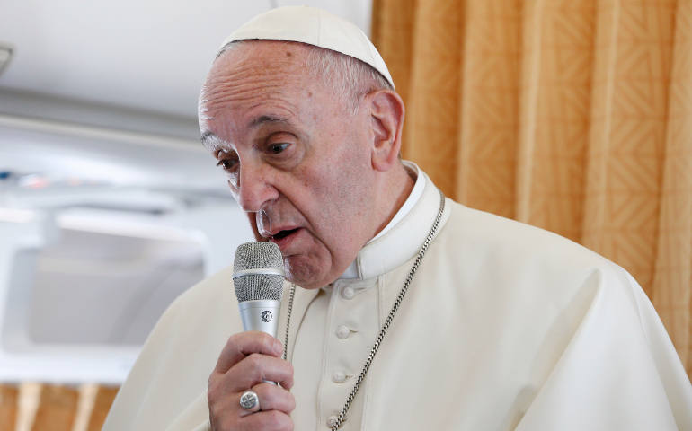 Pope Francis speaks to journalists aboard his flight from Rome to Krakow, Poland, July 27. (CNS/Paul Haring)