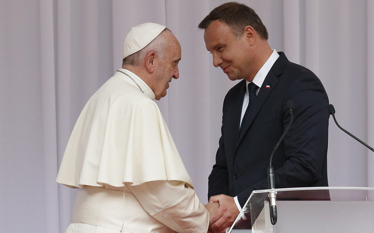Pope Francis exchanges greetings with Polish President Andrzej Duda during a meeting with government authorities and the diplomatic corps in the courtyard of Wawel Royal Castle in Krakow, Poland, July 27. (CNS/Paul Haring)