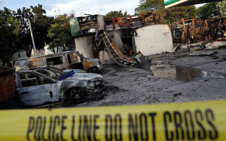 A gas station is seen Aug. 15 after it was burned down following the police shooting of a man in Milwaukee the previous day. (CNS/Aaron P. Bernstein, Reuters)