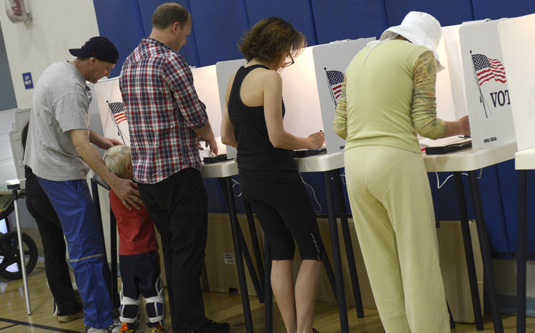 California residents vote in Palisades High School's gymnasium in this 2012 file photo. (CNS/Michael Nelson, EPA)