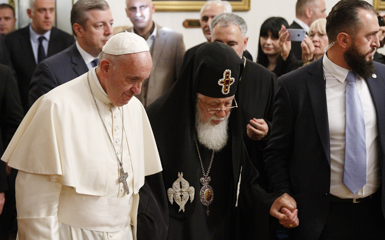 Pope Francis and Orthodox Patriarch Ilia II of Georgia arrive for a meeting at the patriarchal palace Sept. 30 in Tbilisi, Georgia. (CNS/Paul Haring)