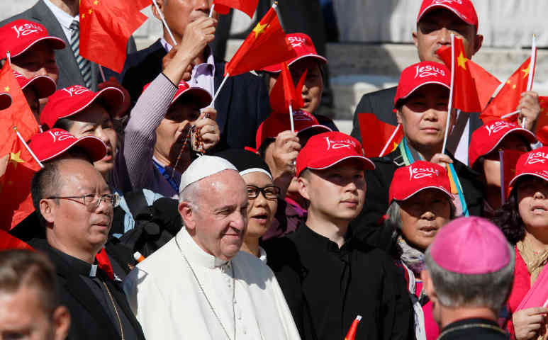 Pope Francis greets pilgrims from China in St. Peter's Square at the Vatican Oct. 5. (CNS/Paul Haring)