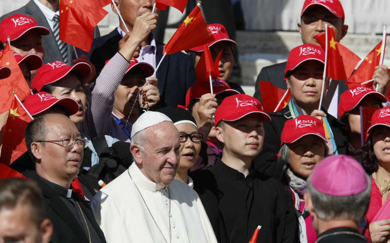 Pope Francis greets pilgrims from China during his general audience in St. Peter's Square at the Vatican Oct. 5. (CNS photo/Paul Haring)