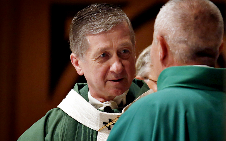 Then-Cardinal-designate Blase Cupich of Chicago shares the sign of peace with a priest during Mass Oct. 9, 2016, at Holy Name Cathedral. (CNS/Catholic New World/Karen Callaway)